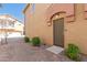 Townhome front door with desert landscaping and a brick paver walkway at 2024 S Baldwin St # 161, Mesa, AZ 85209
