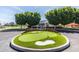 Augusta Ranch Golf Club entrance showing a miniature putting green, signage, trees and the clubhouse at 2024 S Baldwin St # 161, Mesa, AZ 85209