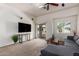 Comfortable living room with balcony access, fan, and neutral decor at 2024 S Baldwin St # 161, Mesa, AZ 85209