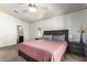 Well-lit main bedroom offers comfortable layout, neutral colors and carpet, promoting calm and relaxation at 2024 S Baldwin St # 161, Mesa, AZ 85209