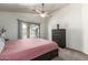 Cozy main bedroom with a plush carpet, ceiling fan and access to the balcony is ideal for relaxation at 2024 S Baldwin St # 161, Mesa, AZ 85209