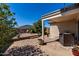 Beautiful backyard patio area, perfect for outdoor entertaining with flowers and nice brickwork at 2116 S 238Th Ln, Buckeye, AZ 85326