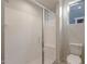 Modern bathroom featuring a glass-enclosed shower and a low-flow toilet at 21281 N 270Th Dr, Buckeye, AZ 85396