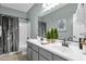 Bathroom featuring a double sink vanity, shower and toilet at 2483 E Narrowleaf Dr, Gilbert, AZ 85298