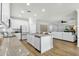 Open kitchen featuring white cabinets, granite counters, stainless appliances, and view of the living room at 2483 E Narrowleaf Dr, Gilbert, AZ 85298