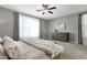 Comfortable bedroom with a ceiling fan, and carpeted floors at 2483 E Narrowleaf Dr, Gilbert, AZ 85298