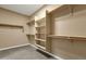 Spacious walk-in closet with built-in shelves and ample storage space at 2483 E Narrowleaf Dr, Gilbert, AZ 85298