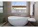 Modern bathroom featuring a soaking tub and minimalist design at 2642 N Fiesta St, Scottsdale, AZ 85257