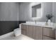 Stylish powder room with modern vanity, elegant lighting, and chic wall textures at 2642 N Fiesta St, Scottsdale, AZ 85257