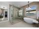 Luxurious bathroom featuring a soaking tub, glass shower, and modern fixtures at 2642 N Fiesta St, Scottsdale, AZ 85257
