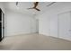 Bright bedroom with a ceiling fan, neutral paint, and closet with sliding doors at 2642 N Fiesta St, Scottsdale, AZ 85257