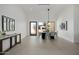 Bright dining room with modern table, chairs, pendant light fixture and door to outside at 2642 N Fiesta St, Scottsdale, AZ 85257