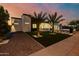 Modern home featuring xeriscaping, a sleek front entrance, and a contemporary black framed garage at 2642 N Fiesta St, Scottsdale, AZ 85257