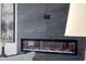 Close up of an electric fireplace with blue and orange flame effect at 2642 N Fiesta St, Scottsdale, AZ 85257