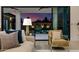 Comfortable living room showing outdoor pool access and stunning sunset views at 2642 N Fiesta St, Scottsdale, AZ 85257