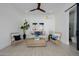 Cozy living room with wicker furniture, a ceiling fan, and bright lighting at 2642 N Fiesta St, Scottsdale, AZ 85257