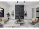 Cozy living room with electric fireplace and white sofas at 2642 N Fiesta St, Scottsdale, AZ 85257