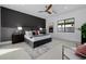 Modern main bedroom featuring a padded headboard, accent wall, and neutral tones at 2642 N Fiesta St, Scottsdale, AZ 85257