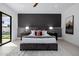 A luxury bedroom suite, with an accent wall and plenty of natural light at 2642 N Fiesta St, Scottsdale, AZ 85257