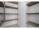 Walk-in pantry features spacious shelving, for organized storage at 2642 N Fiesta St, Scottsdale, AZ 85257