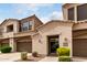 Beautiful townhome showcasing an attached garage, balcony, and desert landscaping, offering a welcoming exterior view at 3131 E Legacy Dr # 2018, Phoenix, AZ 85042