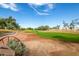 Picturesque golf course with vibrant green grass, mature trees, and a clear blue sky, creating a serene atmosphere at 3131 E Legacy Dr # 2018, Phoenix, AZ 85042