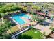 Community pool features zero entry, built in lounge areas, shade structures, and splash pad at 32215 N 16Th Ave, Phoenix, AZ 85085