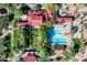 Aerial view of community pool, clubhouse, lounge chairs, splash pad, and landscaping at 32215 N 16Th Ave, Phoenix, AZ 85085
