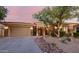 Charming home with stone accents, desert landscaping, and a three-car garage at 32215 N 16Th Ave, Phoenix, AZ 85085