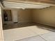 Bright garage featuring epoxy flooring and access to utility closet with water heater at 32215 N 16Th Ave, Phoenix, AZ 85085