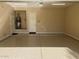 Spacious garage with epoxy flooring, utility sink, and ample storage space at 32215 N 16Th Ave, Phoenix, AZ 85085