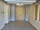 Finished garage featuring epoxy flooring, natural lighting, and neutral color scheme at 32215 N 16Th Ave, Phoenix, AZ 85085