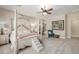 Serene bedroom suite with a canopy bed, plush carpet, and ample natural light at 32215 N 16Th Ave, Phoenix, AZ 85085