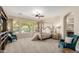 Comfortable bedroom featuring carpet flooring, ceiling fan, and natural light at 32215 N 16Th Ave, Phoenix, AZ 85085