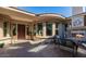 Inviting outdoor patio with stone fireplace, comfortable seating, and lush landscaping at 32215 N 16Th Ave, Phoenix, AZ 85085