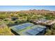 Aerial view of the tennis courts, basketball court, park, and surrounding mountain views at 32215 N 16Th Ave, Phoenix, AZ 85085