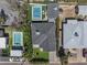 Aerial view of property featuring a pool, well-maintained landscaping, and inviting outdoor space at 3516 E Earll Dr, Phoenix, AZ 85018