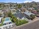 Aerial view of a single Gathering home with a large private pool, landscaping and mountain views at 3516 E Earll Dr, Phoenix, AZ 85018