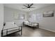 Bright bedroom with ceiling fan, wood-look tile flooring and two twin beds at 3516 E Earll Dr, Phoenix, AZ 85018