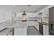 Well-appointed kitchen featuring white cabinets, contrasting countertops, and stainless steel appliances at 3516 E Earll Dr, Phoenix, AZ 85018