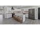 Bright kitchen features white cabinets, granite counters, stainless appliances, and an eat-in island at 3516 E Earll Dr, Phoenix, AZ 85018