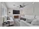 Airy living room offering recessed lighting, modern ceiling fan, and comfortable neutral furnishings at 3516 E Earll Dr, Phoenix, AZ 85018