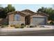 Inviting single-story home featuring a neutral color palette, charming stone accents, and a convenient two-car garage at 356 S Calle Miguel --, Casa Grande, AZ 85194