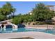 Community pool with a water slide and lush landscaping at 356 S Calle Miguel --, Casa Grande, AZ 85194