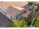 Aerial view of a home showcasing the backyard patio, multiple seating areas, and manicured landscape at 37148 N Stoneware Dr, Queen Creek, AZ 85140
