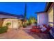 Backyard area with lounge chairs, water feature, and lush landscaping providing a serene retreat at 37148 N Stoneware Dr, Queen Creek, AZ 85140