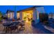 Backyard patio featuring outdoor dining table and chairs with access to indoor living space at 37148 N Stoneware Dr, Queen Creek, AZ 85140