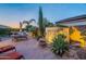 Backyard features a beautiful water feature, fire pit and an outdoor kitchen and dining area at 37148 N Stoneware Dr, Queen Creek, AZ 85140