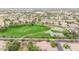 Expansive aerial perspective of a vibrant community featuring parks, a greenbelt, and diverse housing options at 3848 S Coach House Dr, Gilbert, AZ 85297