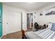 Cozy bedroom with large closet, carpet floors, and natural light, with an ensuite bathroom at 3848 S Coach House Dr, Gilbert, AZ 85297